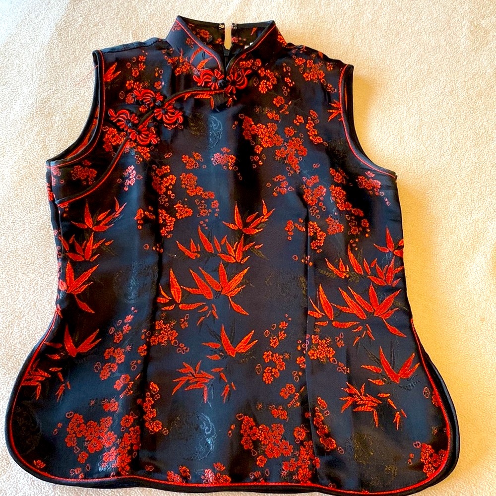 Beautiful Red and black top size Small. Never been worn. No tag